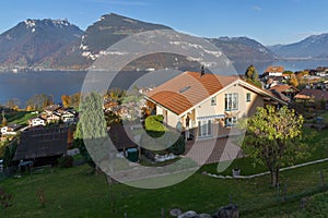 Amazing view of Lake Thun and typical Switzerland village near town of Interlaken