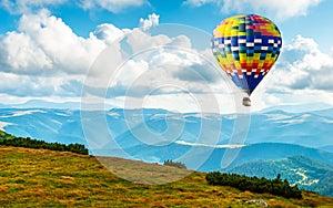 Amazing view of mountains with colorful hot air balloon. Travel concept. Artistic picture. Beauty world