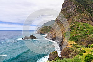 Amazing view of mountains and ocean on the northern coast of Madeira near Boaventura from Vigia viewpoint, Portugal photo