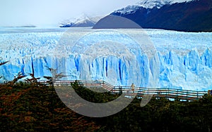 Amazing view of Perito Moreno Glacier with the viewing balcony and fall foliage, Los Glaciares National Park, Argentina