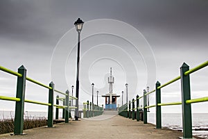 Amazing view of pier with stormy cloudy sky in vanishing point, Buenos Aires Argentina