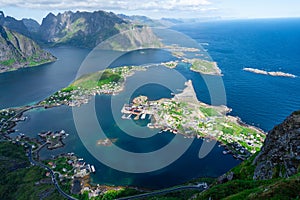 Amazing view from Reinebringen view point. Mountains and blue sea at Lofoten islands. Scenery of Reine fishing village