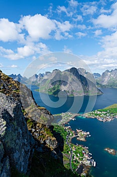 Amazing view from Reinebringen view point. Mountains and blue sea at Lofoten islands. Scenery of Reine fishing village