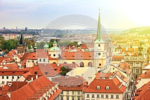 Amazing view of the roofs of buildings and Church of St. Thomas in Prague from the top of St Nicholas Bell Tower