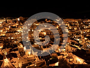 Amazing view of the Sassi of Matera at night. Landscape of the historical part of the town. An Unesco World Heritage Site