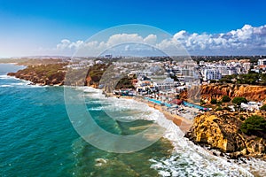 Amazing view from the sky of town Olhos de Agua in Albufeira, Algarve, Portugal. Aerial coastal view of town Olhos de Agua, photo