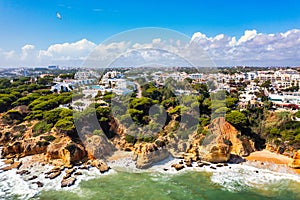 Amazing view from the sky of town Olhos de Agua in Albufeira, Algarve, Portugal. Aerial coastal view of town Olhos de Agua, photo