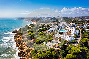 Amazing view from the sky of town Olhos de Agua in Albufeira, Algarve, Portugal. Aerial coastal view of town Olhos de Agua, photo