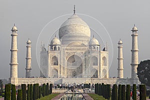 Amazing view on the Taj Mahal in sunset light with reflection in