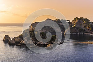 amazing view to a rocky coast and beautiful isle in sea with nice coasline and clouds on the background of the evening sea photo