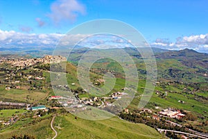 Amazing view of village Calascibetta in Sicily taken with adjacent green hilly landscape. Photographed from the view point in Enna