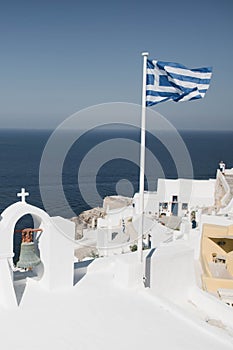 Amazing view of white houses in Oia town on Santorini island in Greece.