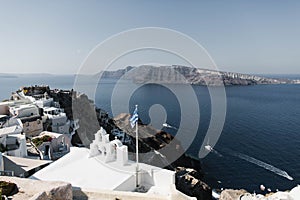 Amazing view of white houses in Oia town on Santorini island in Greece.