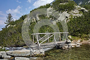 Amazing view of Wooden bridge over River near Vihren hut, Pirin Mountain