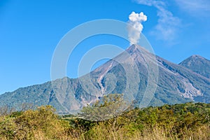 Amazing volcano El Fuego during a eruption on the left and the Acatenango volcano on the right, view from Antigua, Guatemala