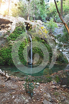 Amazing waterfall flows along the cliff