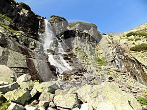 Amazing waterfall between the rocky mountains in the Slovakia