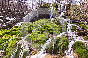 Amazing waterfall stream in forest, early spring. Nature landscape. Waterfall Siga. Homolje mountains photo