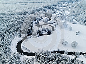 Amazing wild river in frozen forest. Really snowly winter on the north. Aerial panoramic view