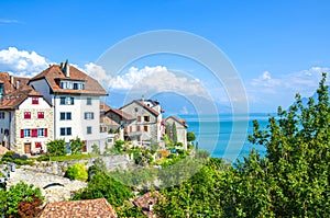 Amazing winemaking village Rivaz in the Swiss Lavaux wine region. Houses and vineyard located on the slopes by the stunning Lake