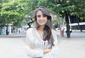 Amazing woman with white blouse in a park