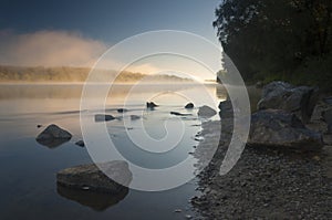 Amazingly beautiful sunrise over Lake, foggy