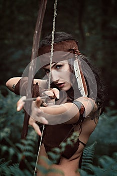 Amazon huntress aiming with bow