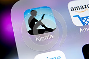 Amazon Kindle application icon on Apple iPhone X screen close-up. Amazon Kindle app icon. Amazon kindle application. Social media