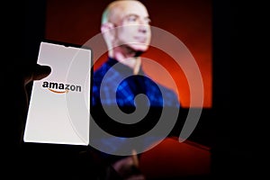 Amazon logo on screen and Jeff Bezos is a Executive Chairman of Amazon in background