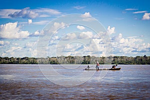 Amazon river boat with blue sky and clouds