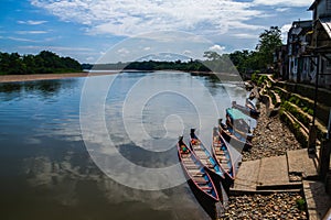 Amazon river with small colorful boats, transportation in the river