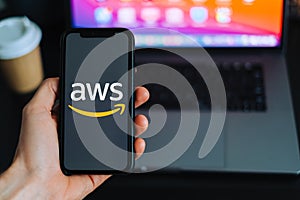 Amazon Web Services logo on the smartphone screen