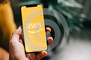 Amazon Web Services logo on the smartphone screen