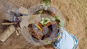 Amazonian indigenous chief cooking ayahuasca