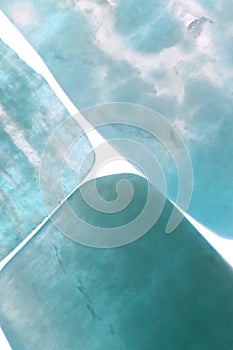 Amazonite jewel stone texture on light surface background