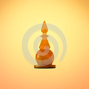 Amber chess set. Chess piece White Bishop on gold gradient background.