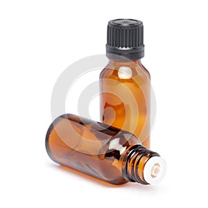 Amber color small glass bottle with pin hole dropper and black cap