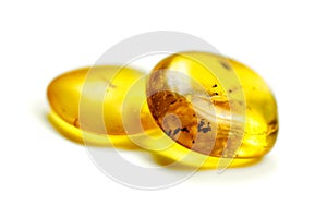 Amber stones with mosquito, isolated