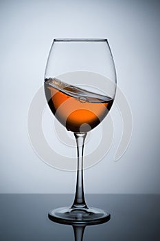 Amber wine. A splash of wine in a glass.