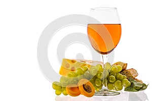 Amber wine. Wine in a glass near fruits