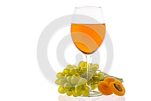 Amber wine. Wine in a glass near fruits and grapes.