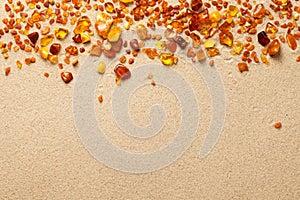 Ambers On Sand Background