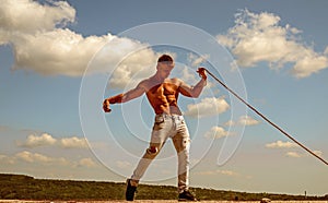 Ambition is the path to success. Athlete with fit torso. Strong man pull rope. Sport man develop muscular hand