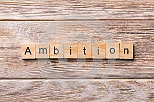 Ambition word written on wood block. ambition text on wooden table for your desing, concept