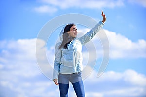 Ambitious and beautiful. Freedom and expectation. Beauty and fashion, look. concept of loneliness. girl blue sky