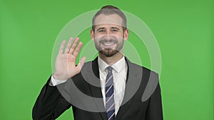 The Ambitious Businessman Waving Hand Sign against Chroma Key