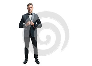 ambitious formal man in tuxedo bowtie isolated on white background. full length