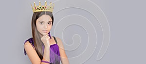 Ambitious girl wear luxury jewelry crown grey background copy space, big boss. Child queen princess in crown horizontal