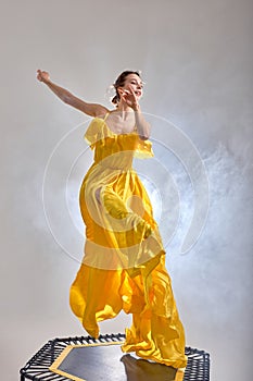 ambitious gorgeous ballet dancer having fun on trampoline