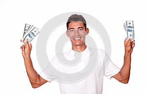 Ambitious man smiling with cash on hands.